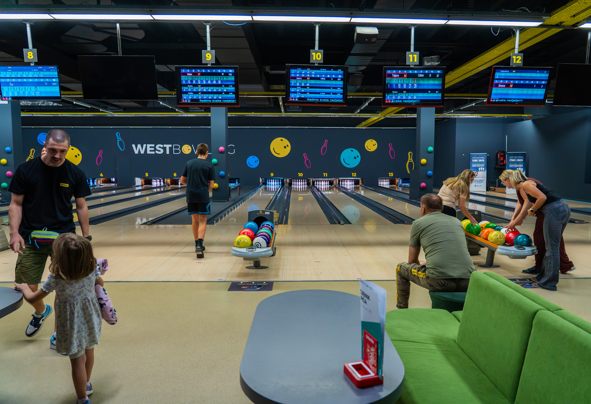Families and players enjoying the bowling lanes at West Bowling